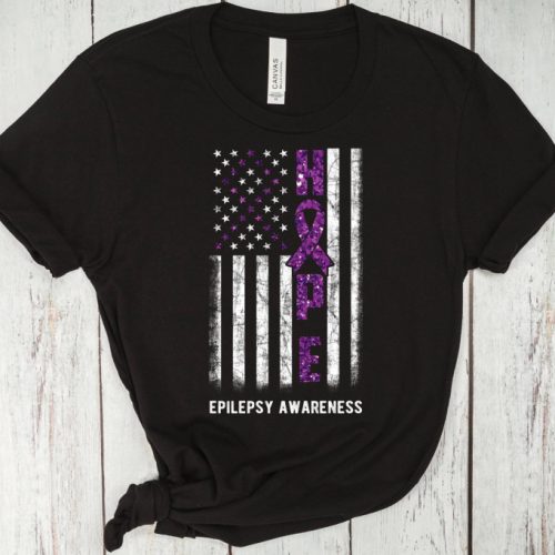 Honor Epilepsy Awareness with our Hope T-Shirt Neurodiversity & Faith Shirt for MomsA Flag Tee: Wear Purple with our Purple Ribbon Tee!